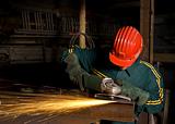  worker with grinder