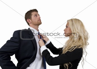 lady knotting tie of man
