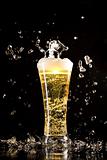 Beer glass with water splashes