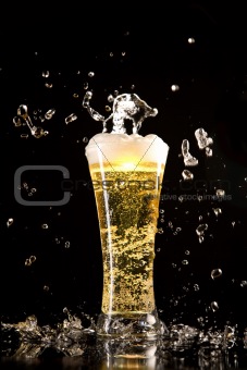 Beer glass with water splashes
