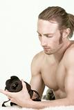 Photographer man with Muscular Build checks camera
