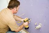 Carpenter Installs Drywall