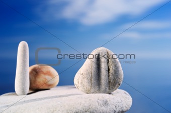 Pebble against the blue sky