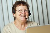 Smiling Senior Adult with Telephone Headset