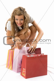 Shopping smile woman. Isolated over white background