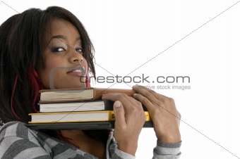 girl keeping her chin on books