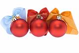 Three red christmas balls with assorted ribbons