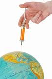 Syringe and terrestrial globe