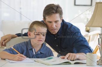 Father helping his son with homework