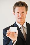 Businessman with blank business card