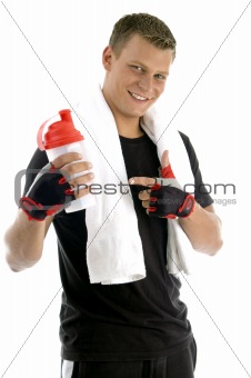 smiling man indicating bottle