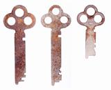Three old sheet metal keys isolated on a white background