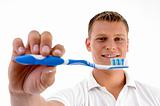 man showing his toothbrush