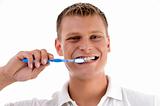 healthy male brushing his teeth
