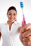 beautiful woman showing her toothbrush
