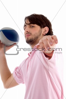 side pose of man with rugby ball