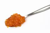 Red caviar on a spoon (up)