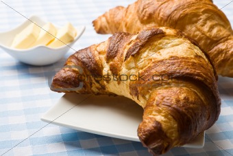 Fresh croissant with butter