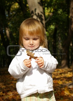 Little girl with oak leaf