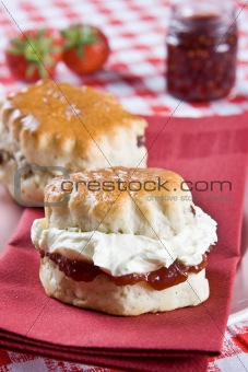 Freshly backed scones with cream and jam