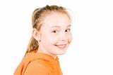 A smiling girl in an orange jumper