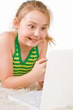 An attractive girl looking at a white laptop (2)