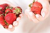 hands with strawberry