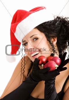 Portrait of the young woman in Santa's hat