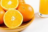 Oranges with a glass of orange juice