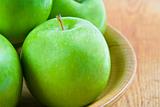 Four green apples