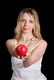 A pretty woman holding an apple. Focus on apple