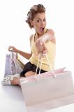 sitting sexy woman showing shopping bags