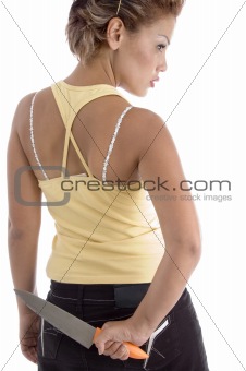 back pose of woman with knife