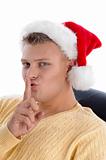 christmas hat wearing male posing to be silent