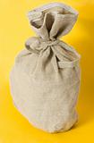 Brown textured sack on yellow background