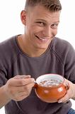 portrait of smiling male going to eat cornflakes