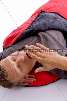 man yawning in sleeping bag