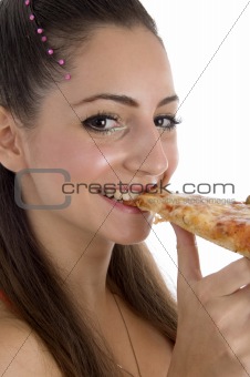 young girl eating pizza
