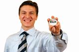 Businessman holding a dealer sign,clipping path included
