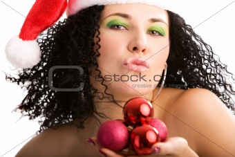 Portrait of the young woman in Santa's hat