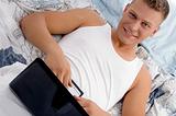 male putting laptop on his stomach