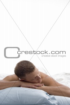 weary man sleeping in bed