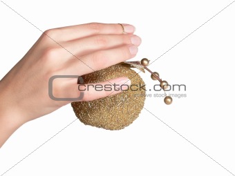 The female hand holds a gold apple. Isolated.