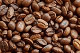 textured background: brown roasted coffee beans macro closeup