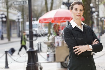 businesswoman in front of hot dog stand