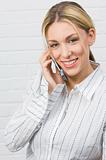 Attractive businesswoman smiling on mobile