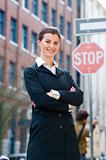 Business woman in front of stop sign