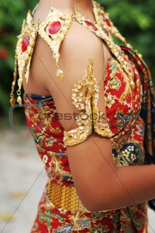 Thai female in bright traditional dress 