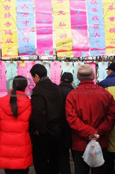 People read good luck messages in China. Chinese New Year celebr