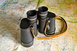 binoculars on map